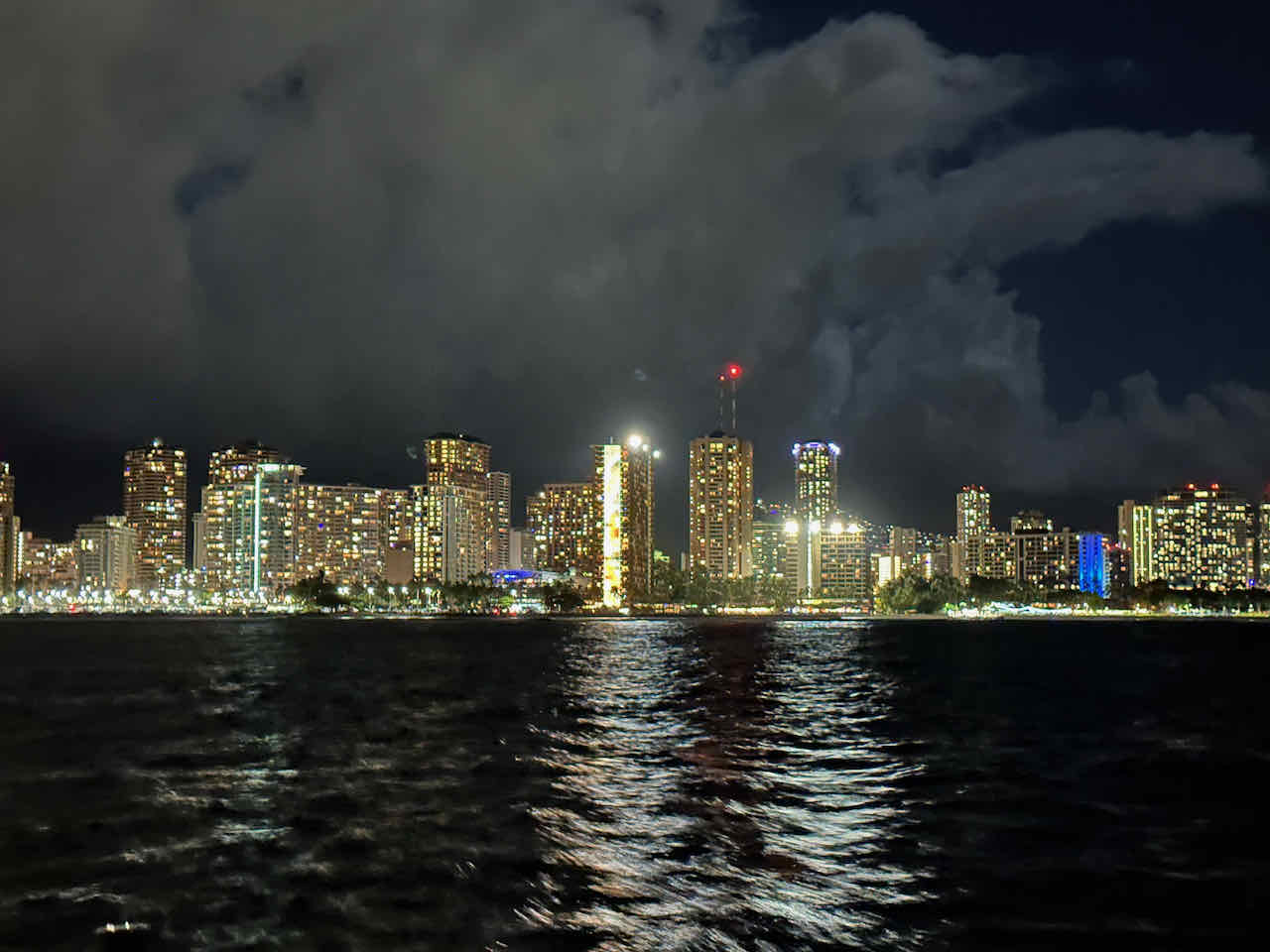 Waikiki at night from sailboat